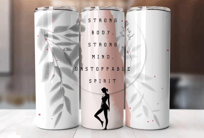 Inspirational 40 oz stainless steel tumbler with silhouette of a woman, and the motivational words 'Strong Body, Strong Mind, Unstoppable Spirit' against a soft pink and white background with delicate flora accents.