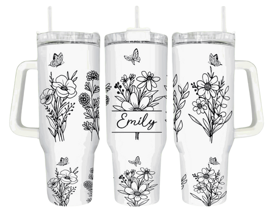 Customizable white floral tumbler featuring space for personalized text, decorated with elegant botanical drawings and butterfly details for a bespoke drinking experience.