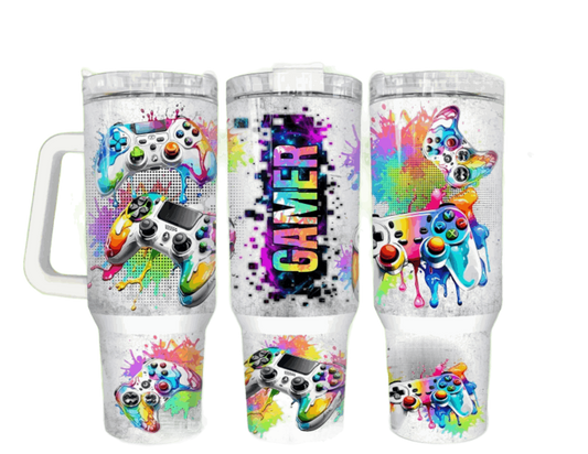 Stylish Gamer Tumblers displaying colorful game controller graphics and a splash paint effect, with the word 'GAMER' prominently featured, perfect for gaming aficionados.