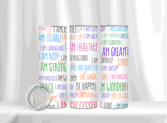 20 oz tumbler covered with colorful affirmations such as 'I AM STRONG', 'I AM HEALTHY', and 'I AM SUCCESSFUL' against a white backdrop for a daily dose of inspiration.