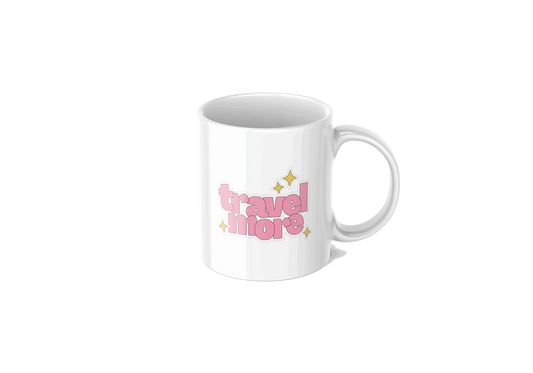 "White travel-themed mug with 'travel more' in pink playful script, accented with yellow and purple stars."